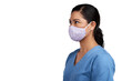 © peopleimages.com - Side shot of a young doctor wearing a surgical face mask Isolated on a PNG background.