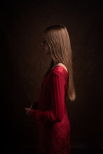 Mysterious Portrait Of Woman In The Shadows Wearing Red Dress In Classic Painterly Renaissance Style