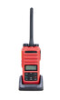 Walkie talkie radio red gadget portable station with battery charger. Receiving-transmitting device designed for operational communication. Isolated cutout PNG background. Concept modern technologie.