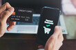 © olando - Man 's hand using mobile smart phone, online payment, Internet banking.