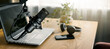 © ronstik - workplace of content creator with microphone, laptop and headphones. home studio for podcasting, online streaming, vlogging. banner with copy space