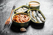 Canned fish in tin cans.