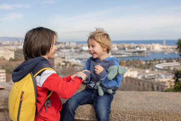 Sticker - Cute little children tourists admiring Barcelona city, family travel with kids