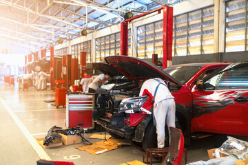 car in automobile repair service center with soft-focus and over light in the background