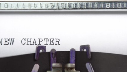 Leinwandbilder - New Chapter phrase close up being typing and centered on a sheet of paper on old vintage typewriter mechanical