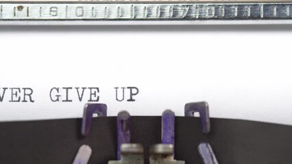 Leinwandbilder - Never Give Up phrase close up being typing and centered on a sheet of paper on old vintage typewriter mechanical