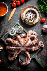 Sticker - Octopus on a cutting Board with garlic and spices.