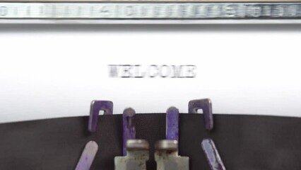 Fototapete - Welcome word closeup being typing and centered on a sheet of paper on old vintage typewriter mechanical