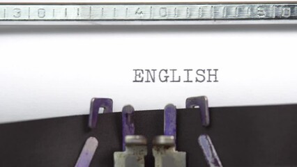 Fototapete - English word closeup being typing and centered on a sheet of paper on old vintage typewriter mechanical
