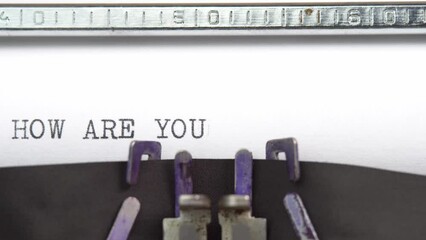 Leinwandbilder - How are you phrase closeup being typing and centered on a sheet of paper on old vintage typewriter mechanical
