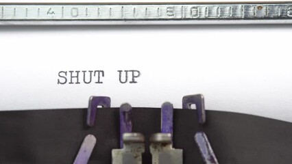 Leinwandbilder - Shut up phrase closeup being typing and centered on a sheet of paper on old vintage typewriter mechanical