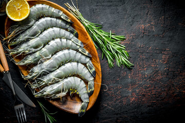 Poster - Raw shrimps with lemon and rosemary.