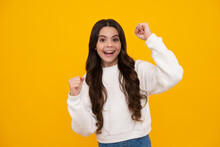 Portrait Of Teenage Girl Child Doing Winner Gesture. Kid Rejoicing, Yes Victory Champion Gesture, Fist Pump. Happy Face, Positive And Smiling Emotions Of Teenager Girl.