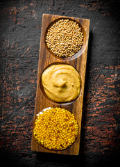 Wall Mural - Mustard in a wooden stand.