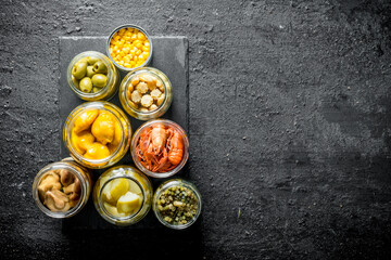 Sticker - Homemade preserved food on a stone Board.