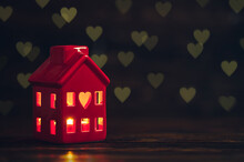 Candle Holder. Ceramic Tealight Holder. Small Red Cozy House With Windows. Light Burning Inside House. Bright Red Candle Flame. Heart Symbol Of Love. Home Decoration. Happy St. Valentine's Day