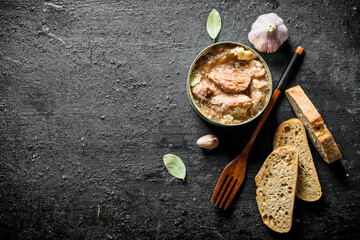 Poster - Canned meat in a tin with a fork and slices of bread.