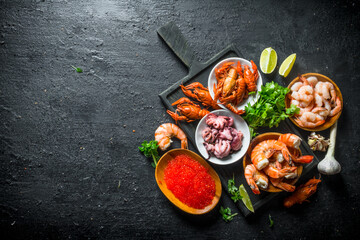 Sticker - Caviar and seafood on a cutting Board with herbs and lime slices.