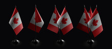 Small National Flags Of The Canada On A Black Background
