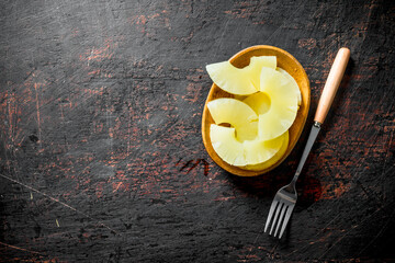 Sticker - Canned pineapples on a plate.