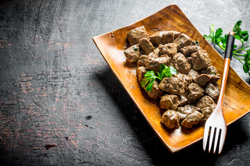 Canvas Print - Fried liver with parsley.