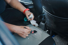 Man Cleaning Leather Car Seat