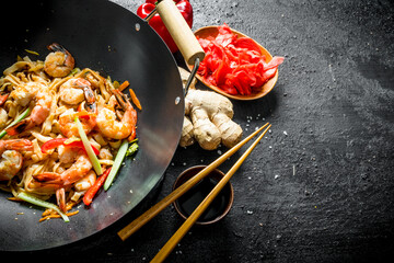 Canvas Print - Wok Udon noodles with ginger, soy sauce and bell pepper.