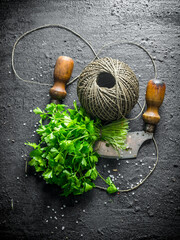 Wall Mural - Fresh parsley with old twine and a knife.