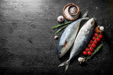 Sticker - Raw fish with spices, rosemary and garlic cloves.