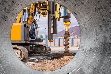 Powerful hydraulic drilling rig at a construction site. The device of pile foundations. Bored piles. Heavy construction equipment.