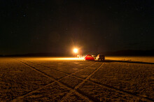 A Small Campsite Is Setup For A Night Time Photoshoot In The Black Rock Desert In Nevada.
