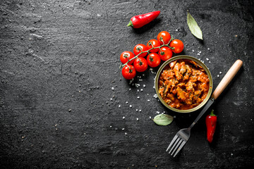 Canvas Print - Canned sprat in a tin with fresh cherry tomatoes.