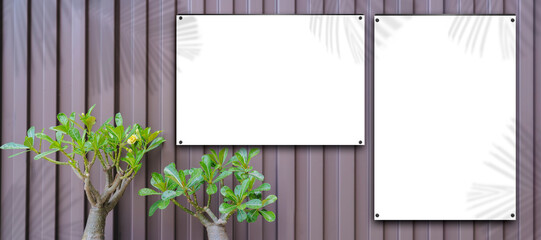 two empty white billboard mockups against metal wall, advertising and commercial concept.