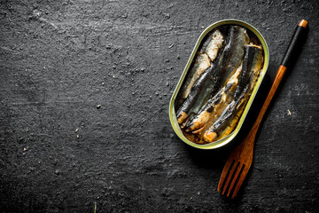 Canvas Print - Open tin can with sprats.