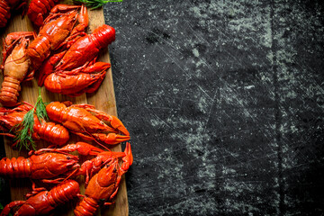Wall Mural - Freshly cooked red crayfish on a cutting Board.