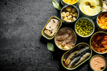 Wall Mural - Assortment of different kinds of canned food in cans.