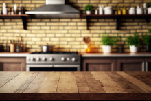 Wood Table Top With Green Plants On Blur Kitchen Counter (room)background.