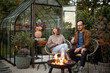 © rh2010 - Young couple having fun spending evening time together during romantic and atmospheric dinner by the fire at beautiful and cozy backyard