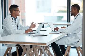 Poster - Healthcare, strategy and planning, doctors in meeting with laptop and discussion at table in hospital meeting room. Teamwork, collaboration and innovation in medical research, men talking in clinic.