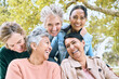 © J Maas/peopleimages.com - Senior women, laughing or bonding in nature park, public garden or relax environment in retirement, support or trust. Smile, happy or diversity elderly friends in comic joke, funny meme or emoji face