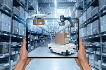 Poster - Warehouse manager with digital tablet controls robot and drone