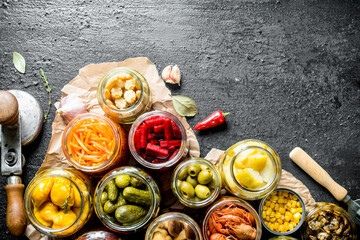 Poster - Assortment of different preserved food in glass jars on paper.