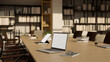 © bongkarn - Laptop on modern wood meeting table in modern office or library co-working space