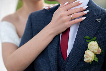 Wall Mural - hands of the bride and groom on the wedding day. concept for event agencies