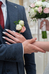 Wall Mural - wedding flowers in the hands of the bride and groom. concept for event agencies