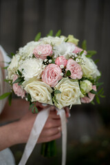 Wall Mural - delicate wedding bouquet in the hands of the bride. idea for event agencies