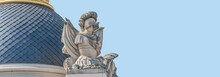 Old Statue Of Renaissance Era Roman Man Knight In Armor, Potsdam, Germany, At Solid Blue Sky Background And Copy Space