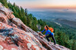 © Cavan Images - A Woman Is Climbing On The Second Flatiron Above Boulder, Colorado, Usa
