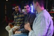 © Serhii - Friends having fun. Happy young men in casual wear drinking beer in pub.