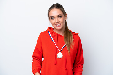 Wall Mural - Young caucasian woman with medals isolated on white background laughing